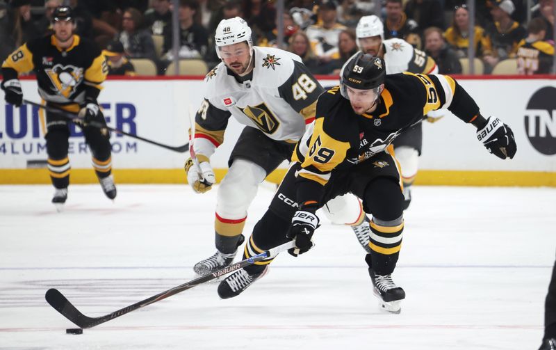 Mar 1, 2026; Pittsburgh, Pennsylvania, USA;  Pittsburgh Penguins right wing Egor Chinakhov (59) moves the puck up ice ahead of Vegas Golden Knights center Tomas Hertl (48) during the third period at PPG Paints Arena. Mandatory Credit: Charles LeClaire-Imagn Images