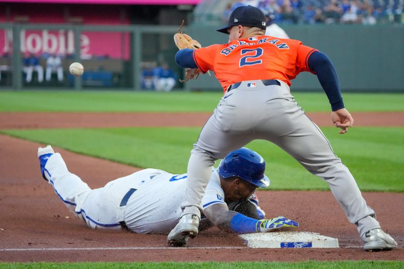 Apr 9, 2024; Kansas City, Missouri, USA; Houston Astros third base Alex Bregman (2) can’t make the tag as Kansas City Royals catcher Salvador Perez (13) slides into third base safely in the third inning at Kauffman Stadium. Mandatory Credit: Denny Medley-USA TODAY Sports