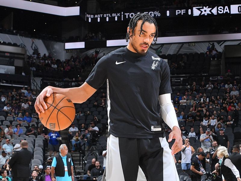 SAN ANTONIO, TX - APRIL 7: Tre Jones #33 of the San Antonio Spurs looks on before the game against the Philadelphia 76ers on April 7, 2024 at the Frost Bank Center in San Antonio, Texas. NOTE TO USER: User expressly acknowledges and agrees that, by downloading and or using this photograph, user is consenting to the terms and conditions of the Getty Images License Agreement. Mandatory Copyright Notice: Copyright 2024 NBAE (Photos by Michael Gonzales/NBAE via Getty Images)