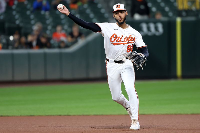 Sep 10, 2025; Baltimore, Maryland, USA; Baltimore Orioles second baseman Jeremiah Jackson (82) throws to first for an out during the fourth inning against the Pittsburgh Pirates at Oriole Park at Camden Yards. Mandatory Credit: Daniel Kucin Jr.-Imagn Images