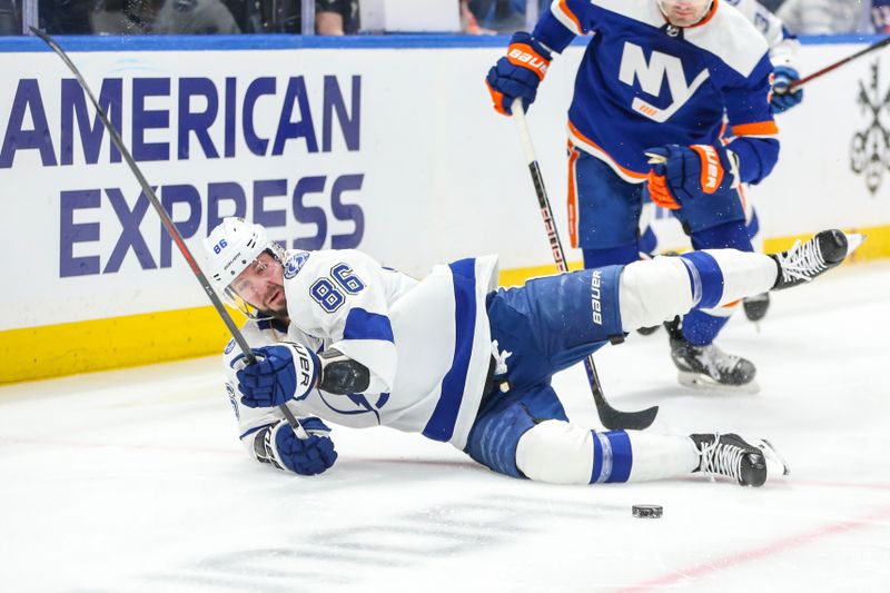 Feb 24, 2024; Elmont, New York, USA;  Tampa Bay Lightning right wing Nikita Kucherov (86) falls on the ice after a collision in the first period against the New York Islanders at UBS Arena. Mandatory Credit: Wendell Cruz-USA TODAY Sports