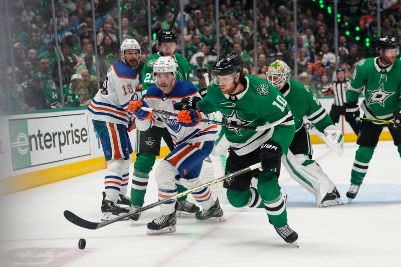 May 31, 2024; Dallas, Texas, USA; Edmonton Oilers center Ryan Nugent-Hopkins (93) and Dallas Stars defenseman Esa Lindell (23) chase the puck during the first period between the Dallas Stars and the Edmonton Oilers in game five of the Western Conference Final of the 2024 Stanley Cup Playoffs at American Airlines Center. Mandatory Credit: Chris Jones-USA TODAY Sports