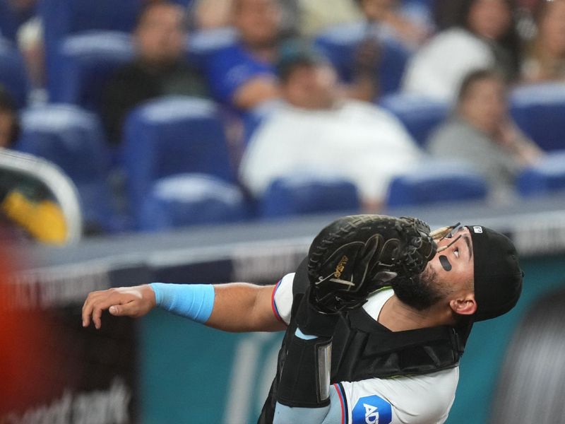 Jul 24, 2024; Miami, Florida, USA;  Miami Marlins catcher Ali Sánchez (47) catches a foul ball in the sixth inning against the Baltimore Orioles at loanDepot Park. Mandatory Credit: Jim Rassol-USA TODAY Sports