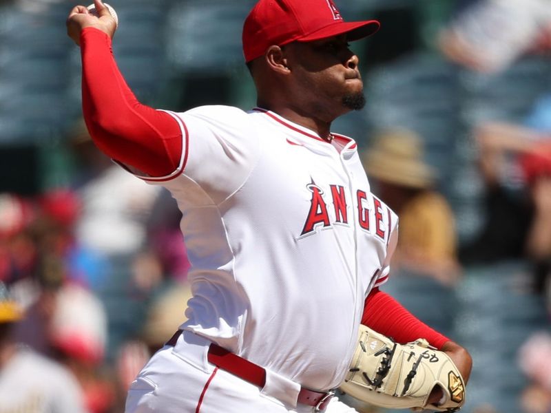 Jun 26, 2024; Anaheim, California, USA;  Los Angeles Angels relief pitcher Guillermo Zuniga (49) pitches during the eighth inning against the Oakland Athletics at Angel Stadium. Mandatory Credit: Kiyoshi Mio-USA TODAY Sports
