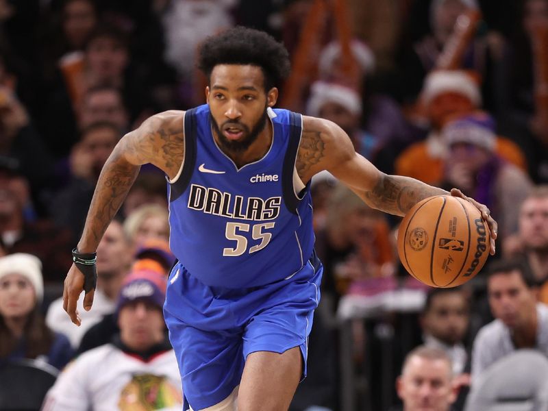 PHOENIX, ARIZONA - DECEMBER 25: Derrick Jones Jr. #55 of the Dallas Mavericks handles the ball during the second half of the NBA game at Footprint Center on December 25, 2023 in Phoenix, Arizona. The Mavericks defeated the Suns 128-114. NOTE TO USER: User expressly acknowledges and agrees that, by downloading and or using this photograph, User is consenting to the terms and conditions of the Getty Images License Agreement.  (Photo by Christian Petersen/Getty Images)