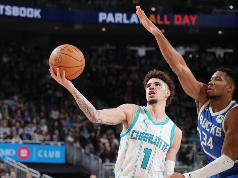 MILWAUKEE, WI - NOVEMBER 23: LaMelo Ball #1 of the Charlotte Hornets drives to the basket during the game against the Milwaukee Bucks on November 23, 2024 at the Fiserv Forum Center in Milwaukee, Wisconsin. NOTE TO USER: User expressly acknowledges and agrees that, by downloading and or using this Photograph, user is consenting to the terms and conditions of the Getty Images License Agreement. Mandatory Copyright Notice: Copyright 2024 NBAE (Photo by Gary Dineen/NBAE via Getty Images).