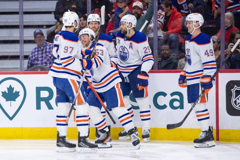 Oct 21, 2025; Ottawa, Ontario, CAN; Edmonton Oilers left wing Isaac Howarrd (53) celebrates a goal with teammates in the second period against the Ottawa Senators at the Canadian Tire Centre. Mandatory Credit: Marc DesRosiers-IMAGN Images