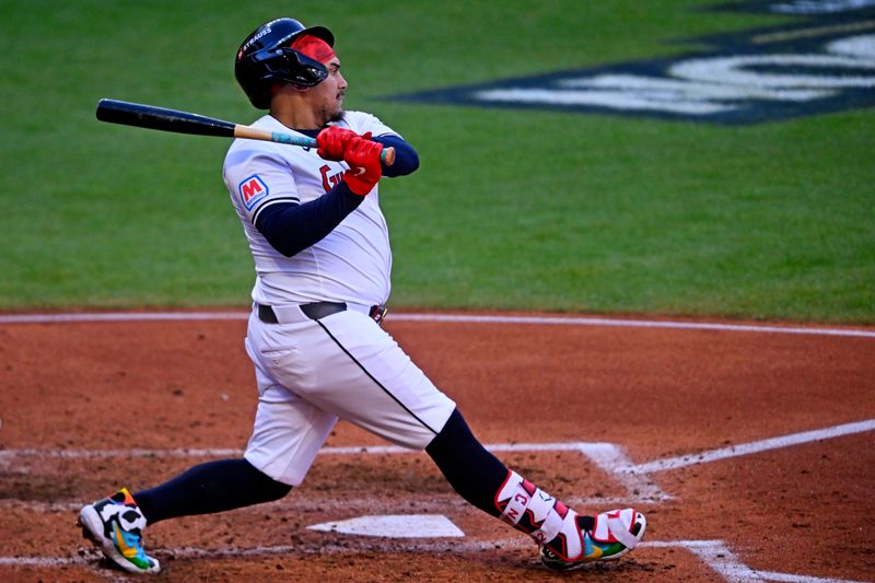 Oct 7, 2024; Cleveland, Ohio, USA; Cleveland Guardians first base Josh Naylor (22) hits a double during the fifth inning against the Detroit Tigers during game two of the ALDS for the 2024 MLB Playoffs at Progressive Field. Mandatory Credit: David Richard-Imagn Images