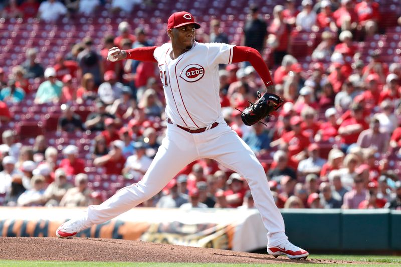 Sep 20, 2023; Cincinnati, Ohio, USA; Cincinnati Reds starting pitcher Hunter Greene (21) throws against the Minnesota Twins during the first inning at Great American Ball Park. Mandatory Credit: David Kohl-USA TODAY Sports