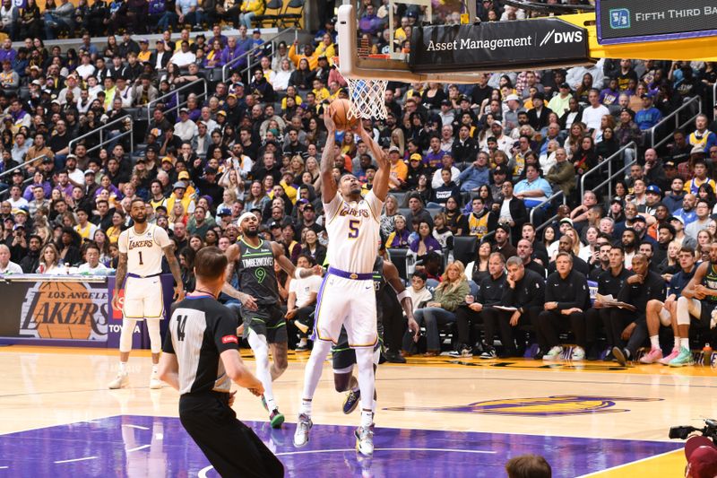 LOS ANGELES, CA - APRIL 7: Cam Reddish #5 of the Los Angeles Lakers drives to the basket during the game against the Minnesota Timberwolves on April 7, 2024 at Crypto.Com Arena in Los Angeles, California. NOTE TO USER: User expressly acknowledges and agrees that, by downloading and/or using this Photograph, user is consenting to the terms and conditions of the Getty Images License Agreement. Mandatory Copyright Notice: Copyright 2024 NBAE (Photo by Juan Ocampo/NBAE via Getty Images)