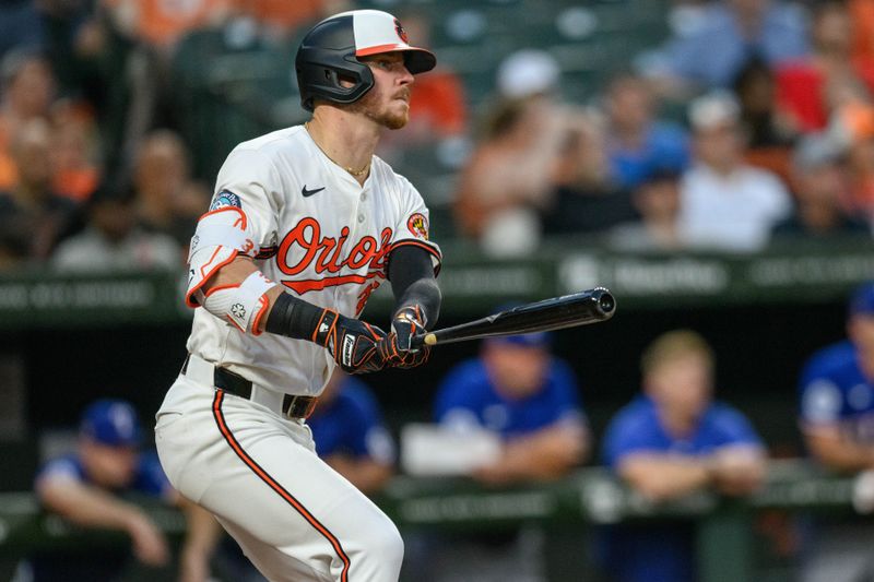 Jun 30, 2024; Baltimore, Maryland, USA; Baltimore Orioles first base Ryan O'Hearn (32) hits a single during the sixth inning against the Texas Rangers at Oriole Park at Camden Yards. Mandatory Credit: Reggie Hildred-USA TODAY Sports