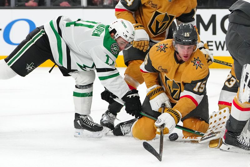 Dec 6, 2024; Las Vegas, Nevada, USA; Vegas Golden Knights defenseman Noah Hanifin (15) looks to protect the puck from Dallas Stars center Logan Stankoven (11) during the first period at T-Mobile Arena. Mandatory Credit: Stephen R. Sylvanie-Imagn Images