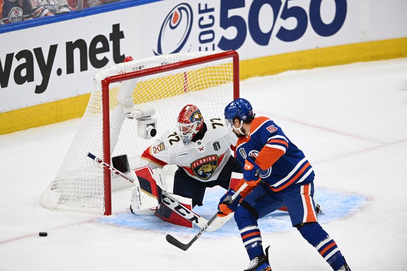 Jun 13, 2024; Edmonton, Alberta, CAN; Edmonton Oilers defenseman Cody Ceci (5) battles Florida Panthers goaltender Sergei Bobrovsky (72) for the puck in the first period in game three of the 2024 Stanley Cup Final at Rogers Place. Mandatory Credit: Walter Tychnowicz-USA TODAY Sports