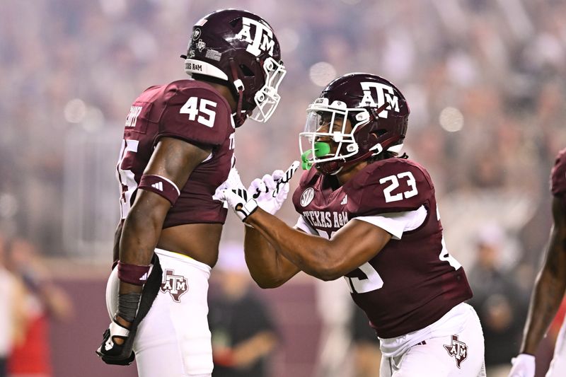 Sep 2, 2023; College Station, Texas, USA; Texas A&M Aggies linebacker Chantz Johnson (23) and linebacker Edgerrin Cooper (45) react to a play during the third quarter against New Mexico Lobos at Kyle Field. Mandatory Credit: Maria Lysaker-USA TODAY Sports