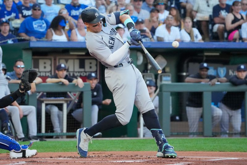 Jun 12, 2024; Kansas City, Missouri, USA; New York Yankees center fielder Aaron Judge (99) hits a single against the Kansas City Royals in the first inning at Kauffman Stadium. Mandatory Credit: Denny Medley-USA TODAY Sports