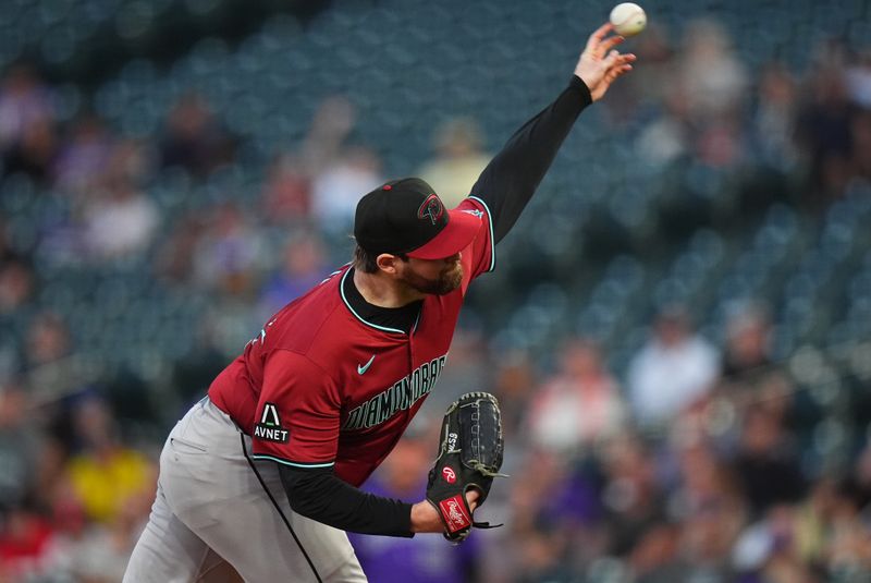 Sep 17, 2024; Denver, Colorado, USA; Arizona Diamondbacks starting pitcher Jordan Montgomery (52) delivers a pitch in the first inning against the Colorado Rockies at Coors Field. Mandatory Credit: Ron Chenoy-Imagn Images