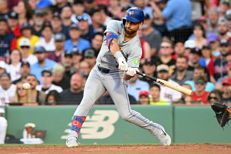 Jun 25, 2024; Boston, Massachusetts, USA; Toronto Blue Jays center fielder Kevin Kiermaier (39) hits a RBI single against the Boston Red Sox during the third inning at Fenway Park. Mandatory Credit: Brian Fluharty-USA TODAY Sports