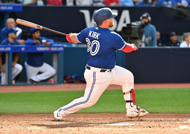 Jul 29, 2023; Toronto, Ontario, CAN; Toronto Blue Jays catcher Alejandro Kirk (30) hits a two run home run against the Los Angeles Angels in the seventh inning at Rogers Centre. Mandatory Credit: Dan Hamilton-USA TODAY Sports