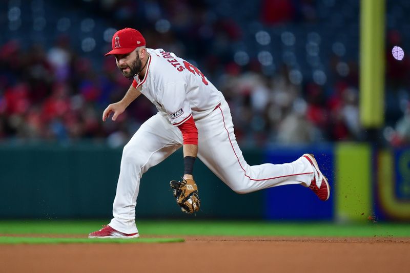 Sep 27, 2024; Anaheim, California, USA; Los Angeles Angels second baseman Michael Stefanic (38) fields the ground ball of Texas Rangers designated hitter Carson Kelly (18) during the ninth inning at Angel Stadium. Mandatory Credit: Gary A. Vasquez-Imagn Images