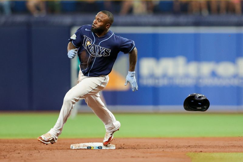 Sep 9, 2023; St. Petersburg, Florida, USA;  Tampa Bay Rays left fielder Randy Arozarena (56) rounds second base against the Seattle Mariners in the first inning at Tropicana Field. Mandatory Credit: Nathan Ray Seebeck-USA TODAY Sports