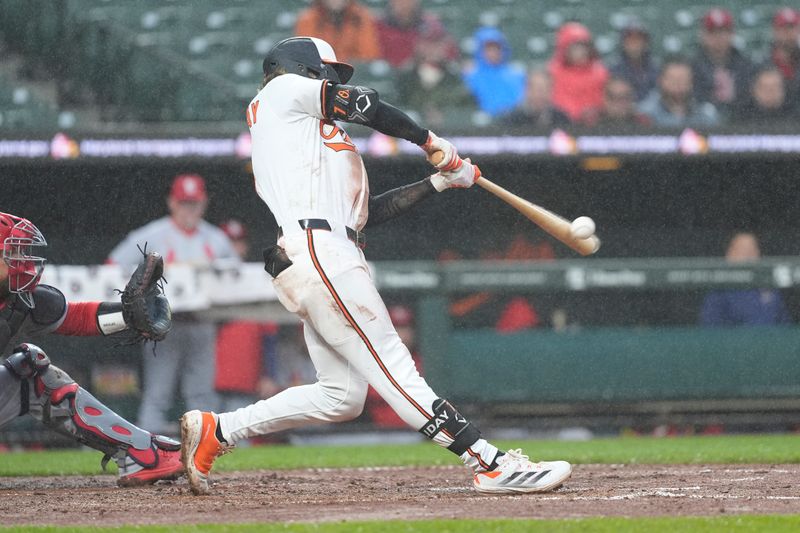 May 28, 2025; Baltimore, Maryland, USA;  Baltimore Orioles second baseman Jackson Holliday (7) hits an RBI double against the St. Louis Cardinals during the second inning at Oriole Park at Camden Yards. Mandatory Credit: Gregory Fisher-Imagn Images