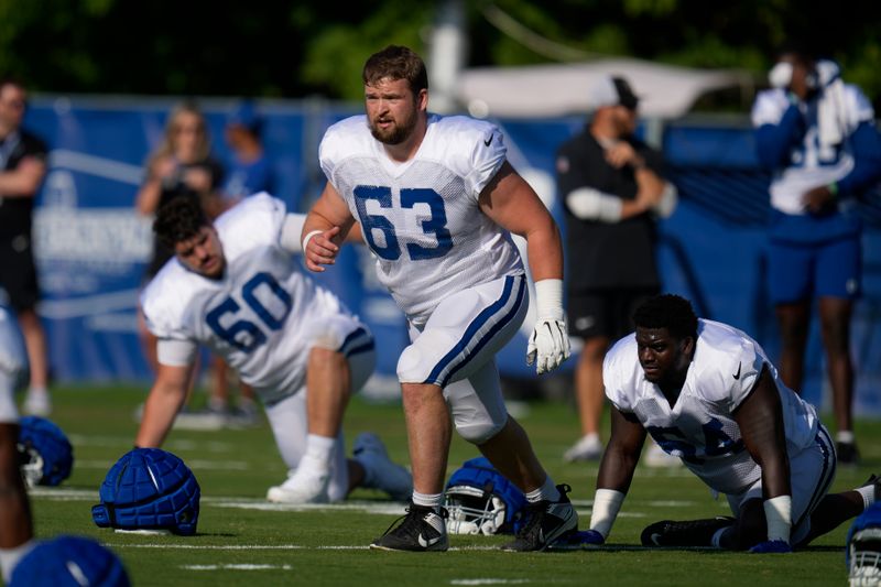 Indianapolis Colts guard Danny Pinter (63) warms up during a joint NFL football practice with the Chicago Bears at the Colts' training camp in Westfield, Ind., Wednesday, Aug. 16, 2023. (AP Photo/Michael Conroy)