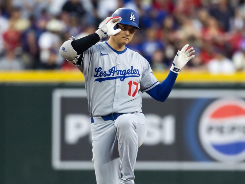 May 9, 2025; Phoenix, Arizona, USA; Los Angeles Dodgers designated hitter Shohei Ohtani celebrates after hitting a double in the second inning against the Arizona Diamondbacks at Chase Field. Mandatory Credit: Mark J. Rebilas-Imagn Images