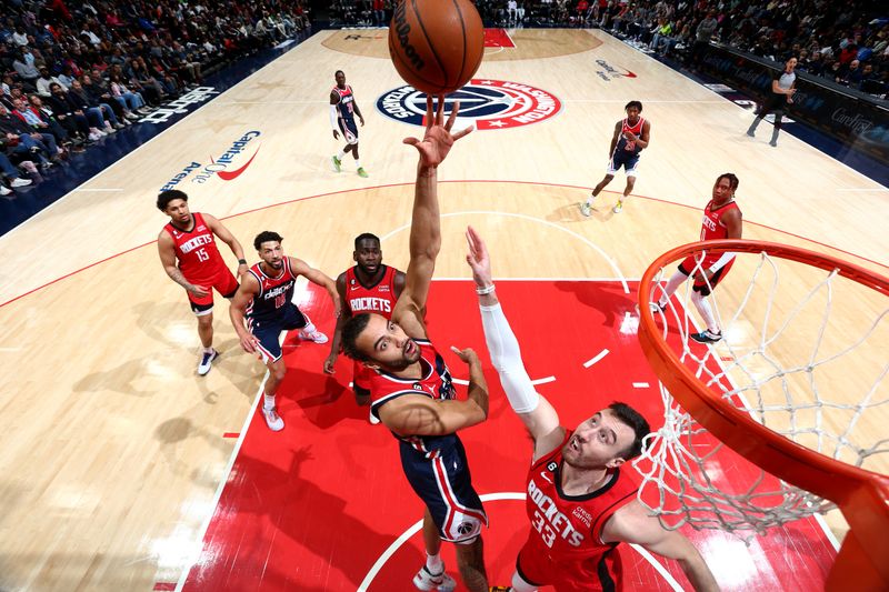 WASHINGTON, DC -? APRIL 9: Xavier Cooks #12 of the Washington Wizards drives to the basket against the Houston Rockets  on April 9, 2023 at Capital One Arena in Washington, DC. NOTE TO USER: User expressly acknowledges and agrees that, by downloading and or using this Photograph, user is consenting to the terms and conditions of the Getty Images License Agreement. Mandatory Copyright Notice: Copyright 2023 NBAE (Photo by Stephen Gosling/NBAE via Getty Images)