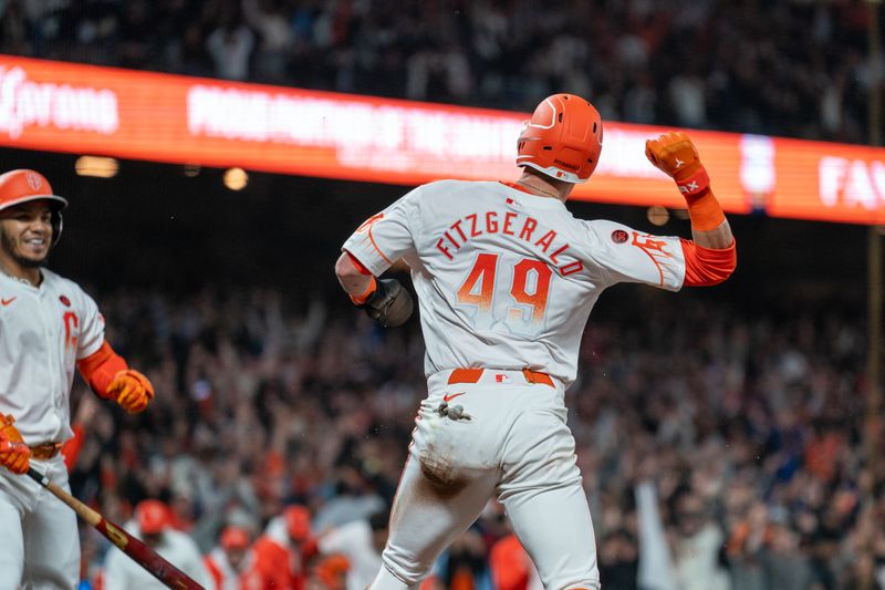 Jul 9, 2024; San Francisco, California, USA;  San Francisco Giants short stop Tyler Fitzgerald (49) celebrates after scoring against the Toronto Blue Jays during the ninth inning to end the game at Oracle Park. Mandatory Credit: Neville E. Guard-USA TODAY Sports