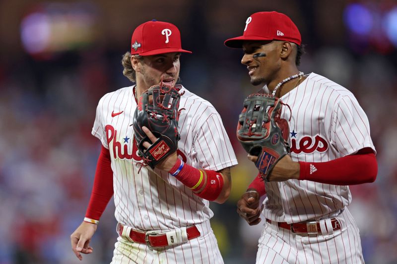 Oct 3, 2023; Philadelphia, Pennsylvania, USA; Philadelphia Phillies second baseman Bryson Stott (5) and center fielder Johan Rojas (18) react after the second inning during game one of the Wildcard series for the 2023 MLB playoffs at Citizens Bank Park. Mandatory Credit: Bill Streicher-USA TODAY Sports