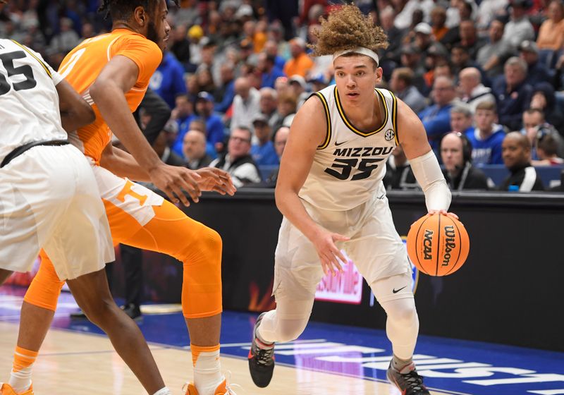 Mar 10, 2023; Nashville, TN, USA;  Missouri Tigers forward Noah Carter (35) dribbles against the Tennessee Volunteers during the second half at Bridgestone Arena. Mandatory Credit: Steve Roberts-USA TODAY Sports