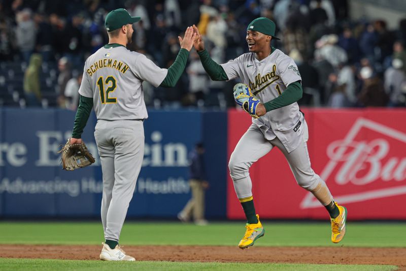 Apr 25, 2024; Bronx, New York, USA; Oakland Athletics left fielder Esteury Ruiz (1) celebrates with third baseman Max Schuemann (12) after defeating the New York Yankees at Yankee Stadium. Mandatory Credit: Vincent Carchietta-USA TODAY Sports