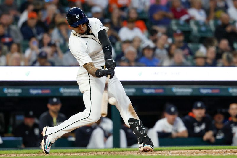 May 12, 2025; Detroit, Michigan, USA; Detroit Tigers third base Javier Báez (28) hits an RBI single sixth inning against the Boston Red Sox at Comerica Park. Mandatory Credit: Rick Osentoski-Imagn Images
