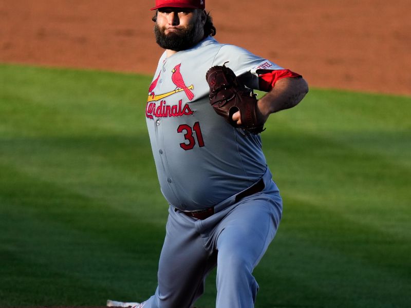 Mar 19, 2024; Port St. Lucie, Florida, USA; St. Louis Cardinals starting pitcher Lance Lynn (31) throws a pitch against the New York Mets during the second inning at Clover Park. Mandatory Credit: Rich Storry-USA TODAY Sports