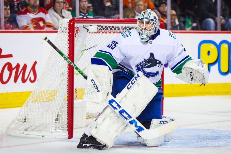 Dec 2, 2023; Calgary, Alberta, CAN; Vancouver Canucks goaltender Thatcher Demko (35) guards his net against the Calgary Flames during the second period at Scotiabank Saddledome. Mandatory Credit: Sergei Belski-USA TODAY Sports