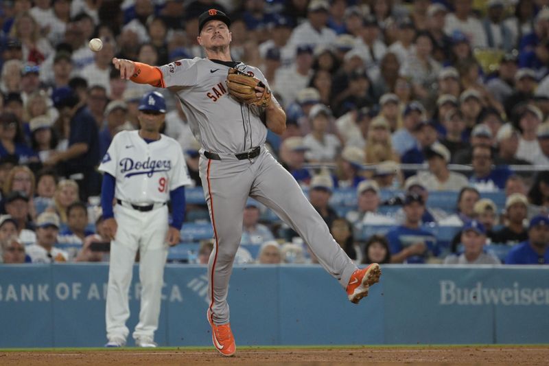 Jul 22, 2024; Los Angeles, California, USA;  San Francisco Giants third baseman Matt Chapman (26) makes a play against the Los Angeles Dodgers in the sixth inning at Dodger Stadium. Mandatory Credit: Jayne Kamin-Oncea-USA TODAY Sports