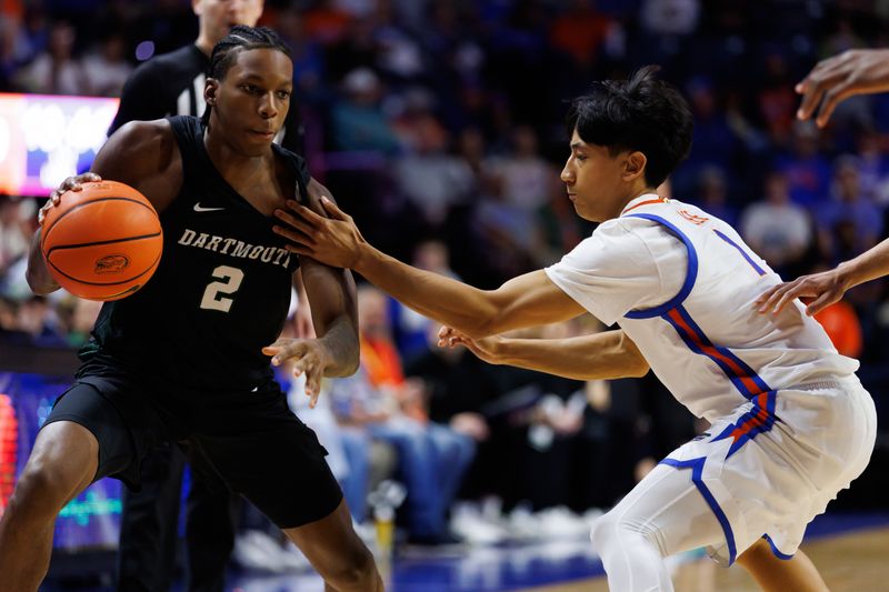 Dec 29, 2025; Gainesville, Florida, USA; Florida Gators guard Xaivian Lee (1) defends Dartmouth Big Green guard Kareem Thomas (2) during the first half at Exactech Arena at the Stephen C. O'Connell Center. Mandatory Credit: Matt Pendleton-Imagn Images