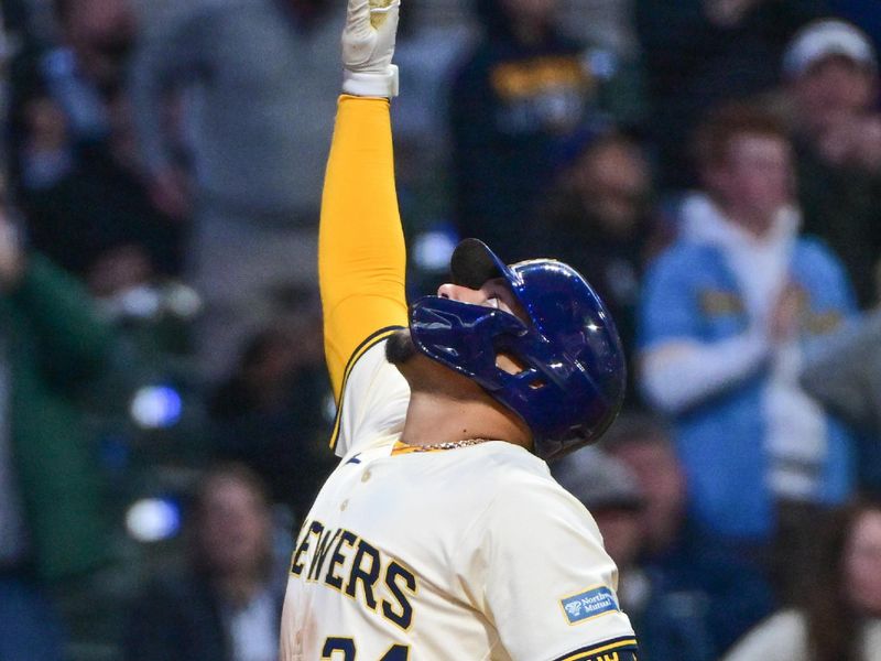 Apr 7, 2024; Milwaukee, Wisconsin, USA; Milwaukee Brewers catcher William Contreras (24) celebrates after hitting a two-run home run in the second inning against the Seattle Mariners at American Family Field. Mandatory Credit: Benny Sieu-USA TODAY Sports