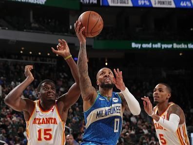 MILWAUKEE, WI - DECEMBER 2: Damian Lillard #0 of the Milwaukee Bucks drives to the basket during the game against the Atlanta Hawks on December 2, 2023 at the Fiserv Forum Center in Milwaukee, Wisconsin. NOTE TO USER: User expressly acknowledges and agrees that, by downloading and or using this Photograph, user is consenting to the terms and conditions of the Getty Images License Agreement. Mandatory Copyright Notice: Copyright 2023 NBAE (Photo by Gary Dineen/NBAE via Getty Images).