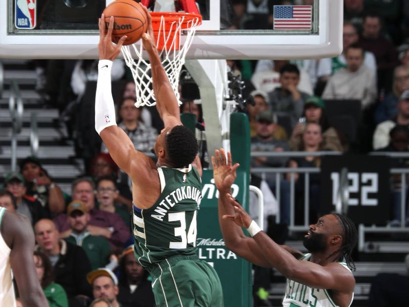 MILWAUKEE, WI - NOVEMBER 10: Giannis Antetokounmpo #34 of the Milwaukee Bucks rebounds during the game against the Boston Celtics on November 10, 2024 at the Fiserv Forum Center in Milwaukee, Wisconsin. NOTE TO USER: User expressly acknowledges and agrees that, by downloading and or using this Photograph, user is consenting to the terms and conditions of the Getty Images License Agreement. Mandatory Copyright Notice: Copyright 2024 NBAE (Photo by Gary Dineen/NBAE via Getty Images).