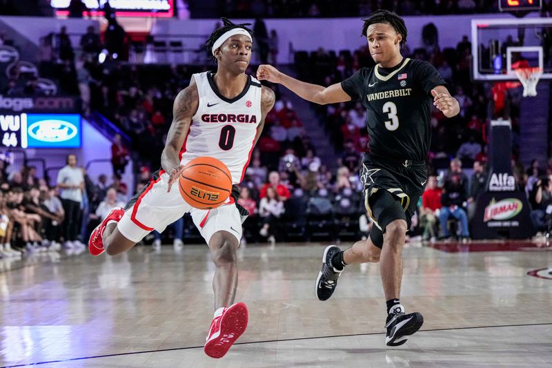 Jan 21, 2023; Athens, Georgia, USA; Georgia Bulldogs guard Terry Roberts (0) dribbles against Vanderbilt Commodores guard Paul Lewis (3) during the second half at Stegeman Coliseum. Mandatory Credit: Dale Zanine-USA TODAY Sports