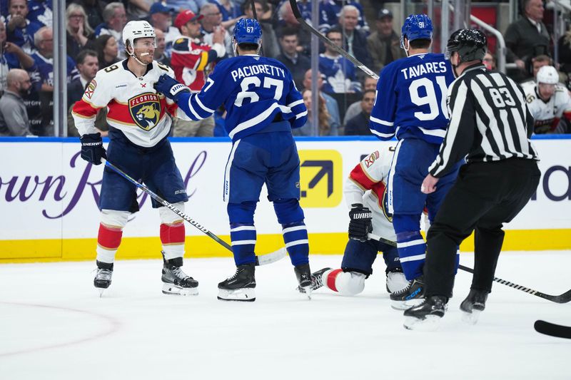 May 7, 2025; Toronto, Ontario, CAN; Toronto Maple Leafs left wing Max Pacioretty (67) battles with Florida Panthers left wing Matthew Tkachuk (19) during the second period in game two of the second round of the 2025 Stanley Cup Playoffs at Scotiabank Arena. Mandatory Credit: Nick Turchiaro-Imagn Images