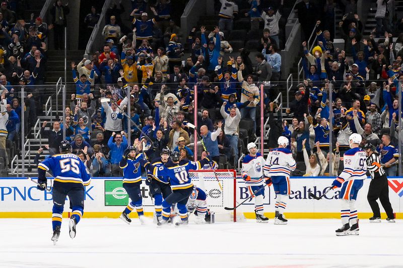 Nov 3, 2025; St. Louis, Missouri, USA; St. Louis Blues center Pius Suter (22) celebrates with teammates after scoring the game winning goal against the Edmonton Oilers at Enterprise Center. Mandatory Credit: Jeff Curry-Imagn Images