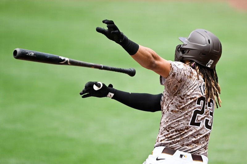 Jun 9, 2024; San Diego, California, USA; San Diego Padres right fielder Fernando Tatis Jr. (23) hits a solo home run during the first inning against the Arizona Diamondbacks at Petco Park. Mandatory Credit: Denis Poroy-USA TODAY Sports at Petco Park. 