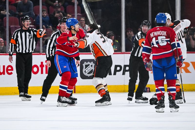 Feb 13, 2024; Montreal, Quebec, CAN; Montreal Canadiens defenseman Johnathan Kovacevic (26) fights with Anaheim Ducks center Sam Carrick (39) during the third period at Bell Centre. Mandatory Credit: David Kirouac-USA TODAY Sports