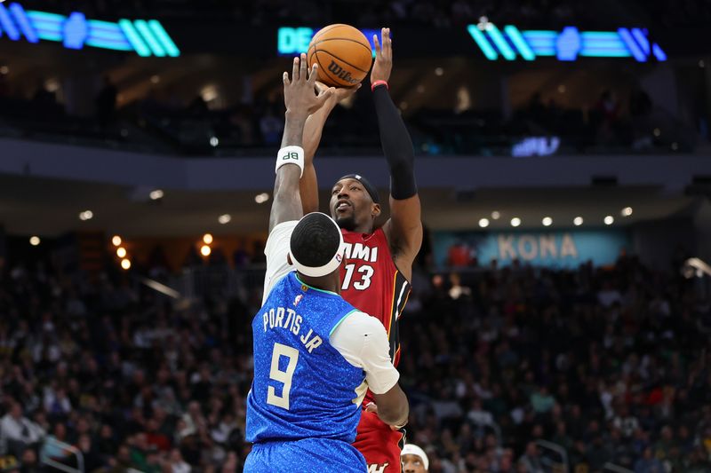 MILWAUKEE, WISCONSIN - FEBRUARY 13: Bam Adebayo #13 of the Miami Heat shoots over Bobby Portis #9 of the Milwaukee Bucks during the second half of a game at Fiserv Forum on February 13, 2024 in Milwaukee, Wisconsin. NOTE TO USER: User expressly acknowledges and agrees that, by downloading and or using this photograph, User is consenting to the terms and conditions of the Getty Images License Agreement. (Photo by Stacy Revere/Getty Images)