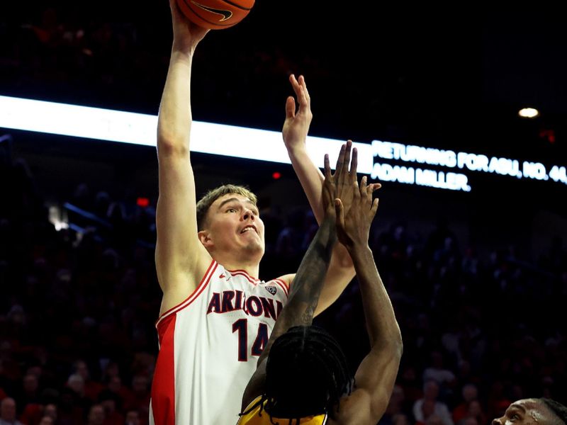 Feb 17, 2024; Tucson, Arizona, USA; Arizona Wildcats center Motiejus Krivas (14) shoots a basket against Arizona State Sun Devils guard Jamiya Neal (5) during the second half at McKale Center. Mandatory Credit: Zachary BonDurant-USA TODAY Sports