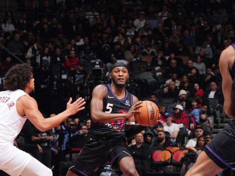 TORONTO, CANADA - FEBRUARY 12: Immanuel Quickley #5 of the Toronto Raptors passes the ball during the game against the Cleveland Cavaliers on February 12, 2025 at the Scotiabank Arena in Toronto, Ontario, Canada.  NOTE TO USER: User expressly acknowledges and agrees that, by downloading and or using this Photograph, user is consenting to the terms and conditions of the Getty Images License Agreement.  Mandatory Copyright Notice: Copyright 2025 NBAE (Photo by Mark Blinch/NBAE via Getty Images)