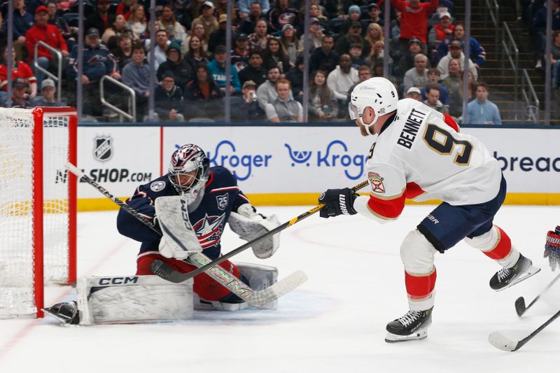 Mar 5, 2026; Columbus, Ohio, USA; Columbus Blue Jackets goalie Jet Greaves (73) makes a save on the shot from Florida Panthers center Sam Bennett (9) during the first period at Nationwide Arena. Mandatory Credit: Russell LaBounty-Imagn Images