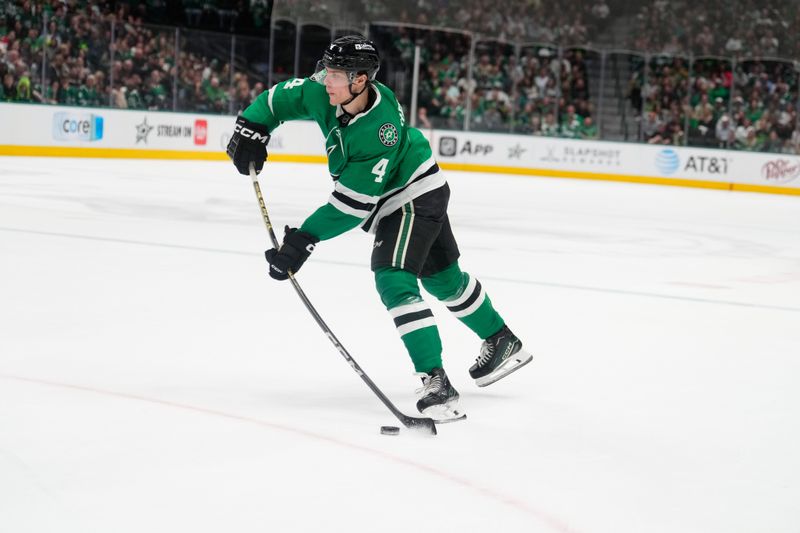 Mar 2, 2024; Dallas, Texas, USA; Dallas Stars defenseman Miro Heiskanen (4) takes a shot on goal against the San Jose Sharks during the second period at American Airlines Center. Mandatory Credit: Chris Jones-USA TODAY Sports